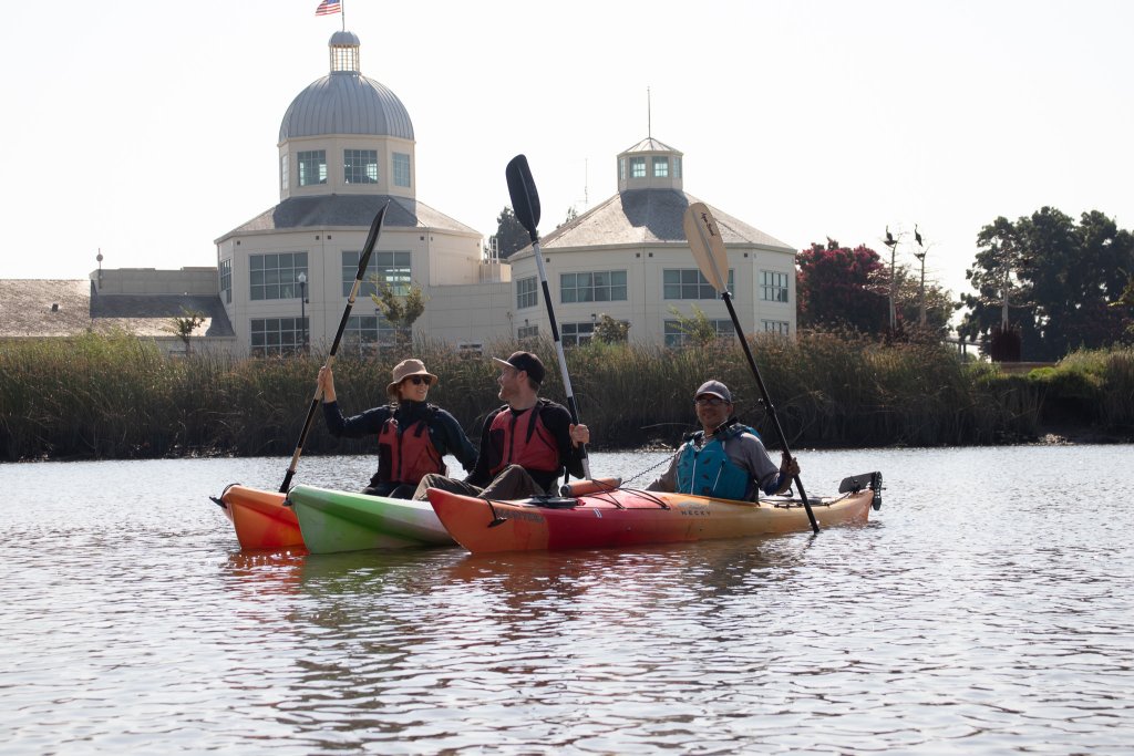 3 people kayaking in the Suisun Marsh
